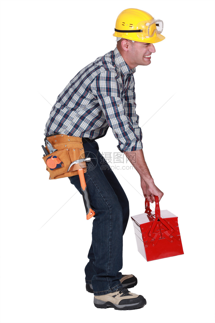 一个建筑工人 带着一个重型工具箱图片