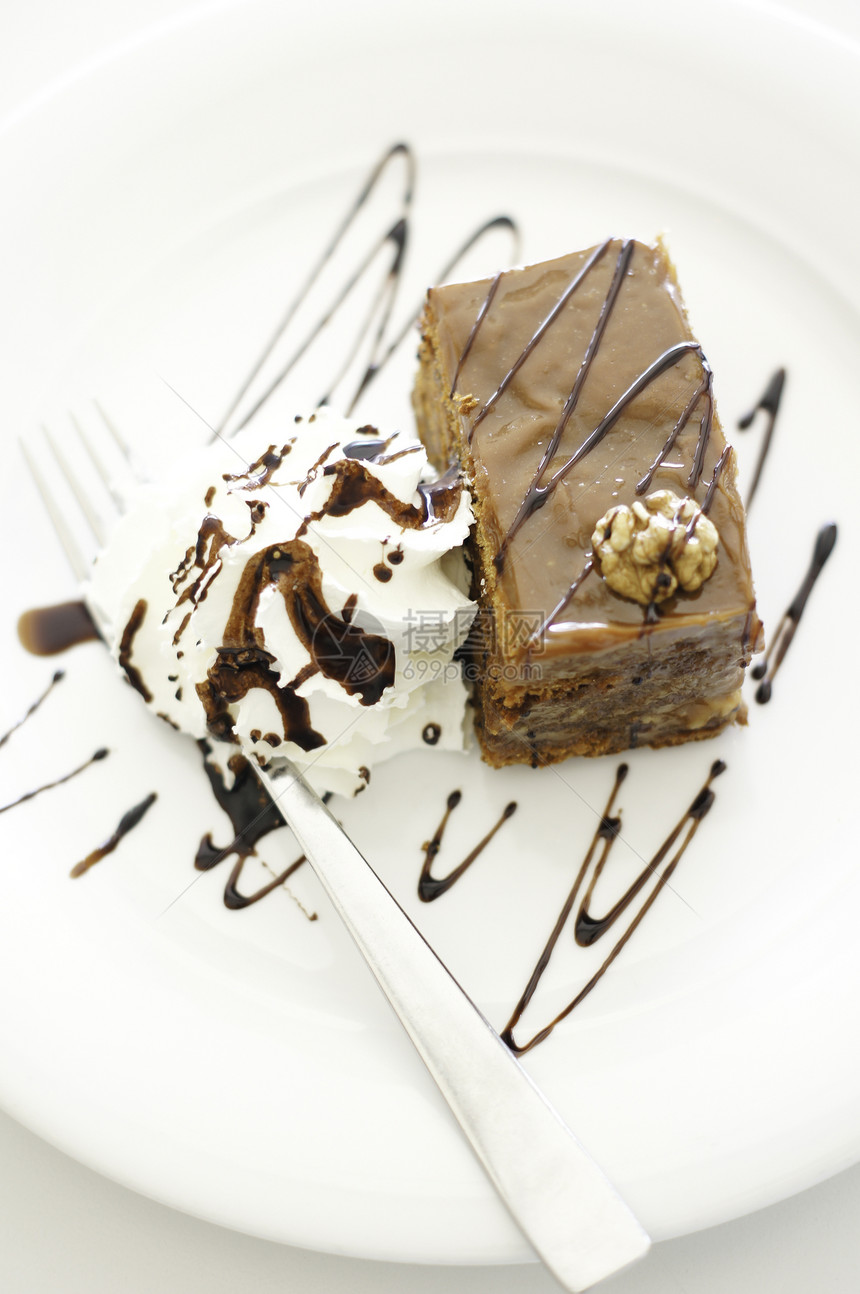 巧克力布朗尼加香草冰淇淋和巧克力酱小吃盘子蛋糕奶油服务甜点配料餐厅咖啡店图片