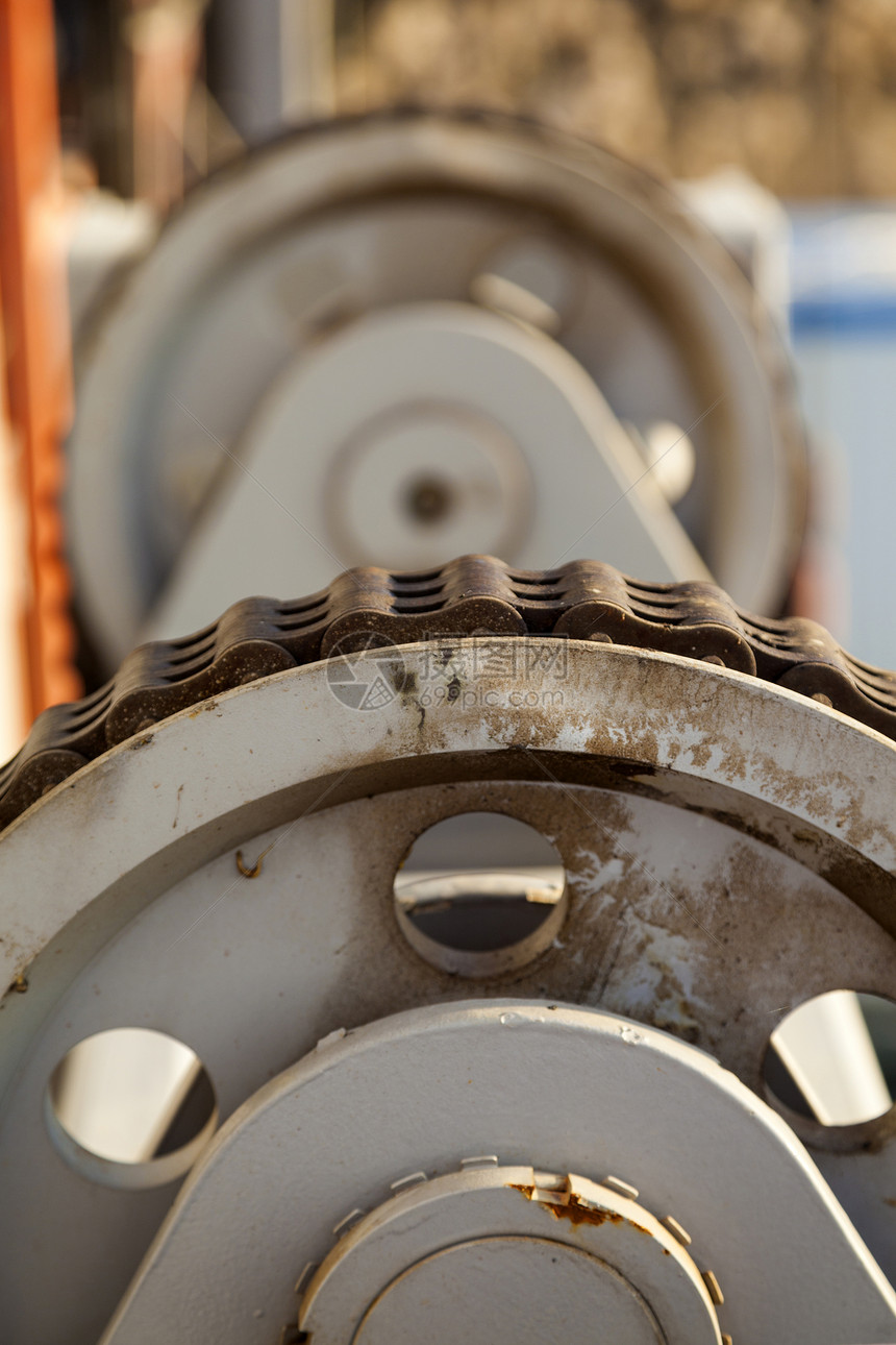 旋转轮和链机械工业发条运动零件牙齿力学旋转车轮引擎图片