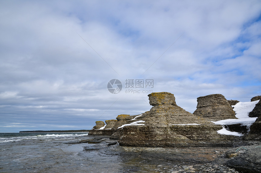 岩石构造海岸太阳悬崖编队旅游天空海岸线风景灰色石头图片