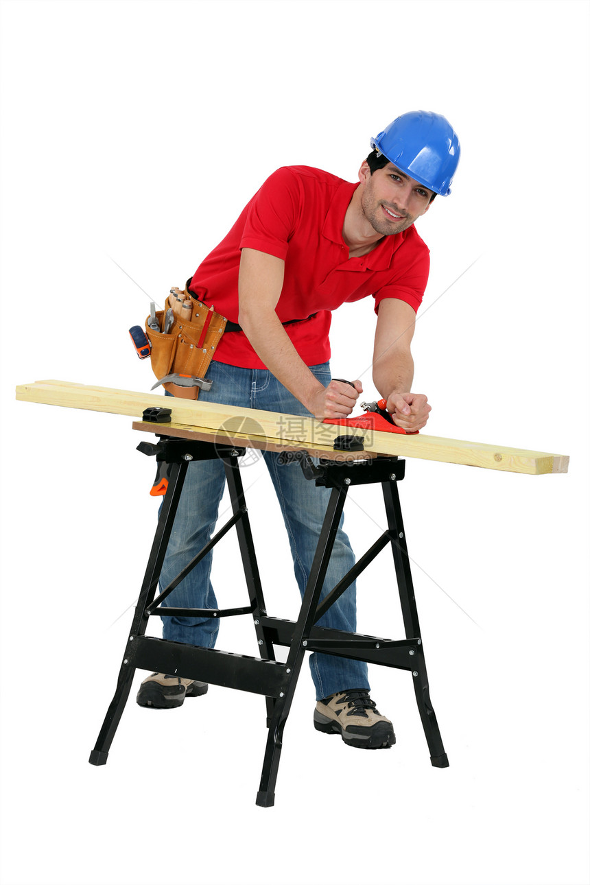 在木板上工作的工匠铺板锉刀住房修理修理工职业精神统治者木头男人图片