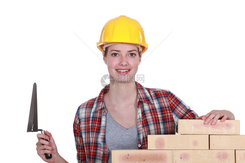 女性砖匠画笔工人安全帽建筑手套商业承包商工作女孩建设者图片