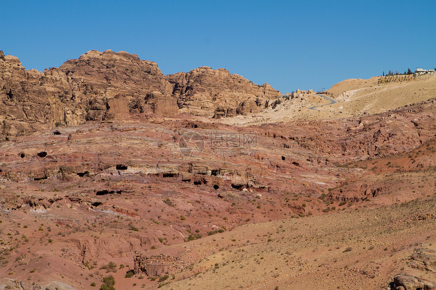 约旦佩特拉的景观岩石沙漠历史性砂岩红色历史遗产石头金库雕刻图片