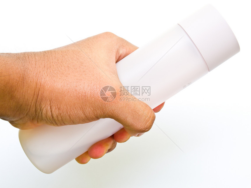 一只粉红色塑料瓶手握着 在白色背景上隔离淋浴身体瓶子洗发水洗澡产品温泉塑料头发液体图片