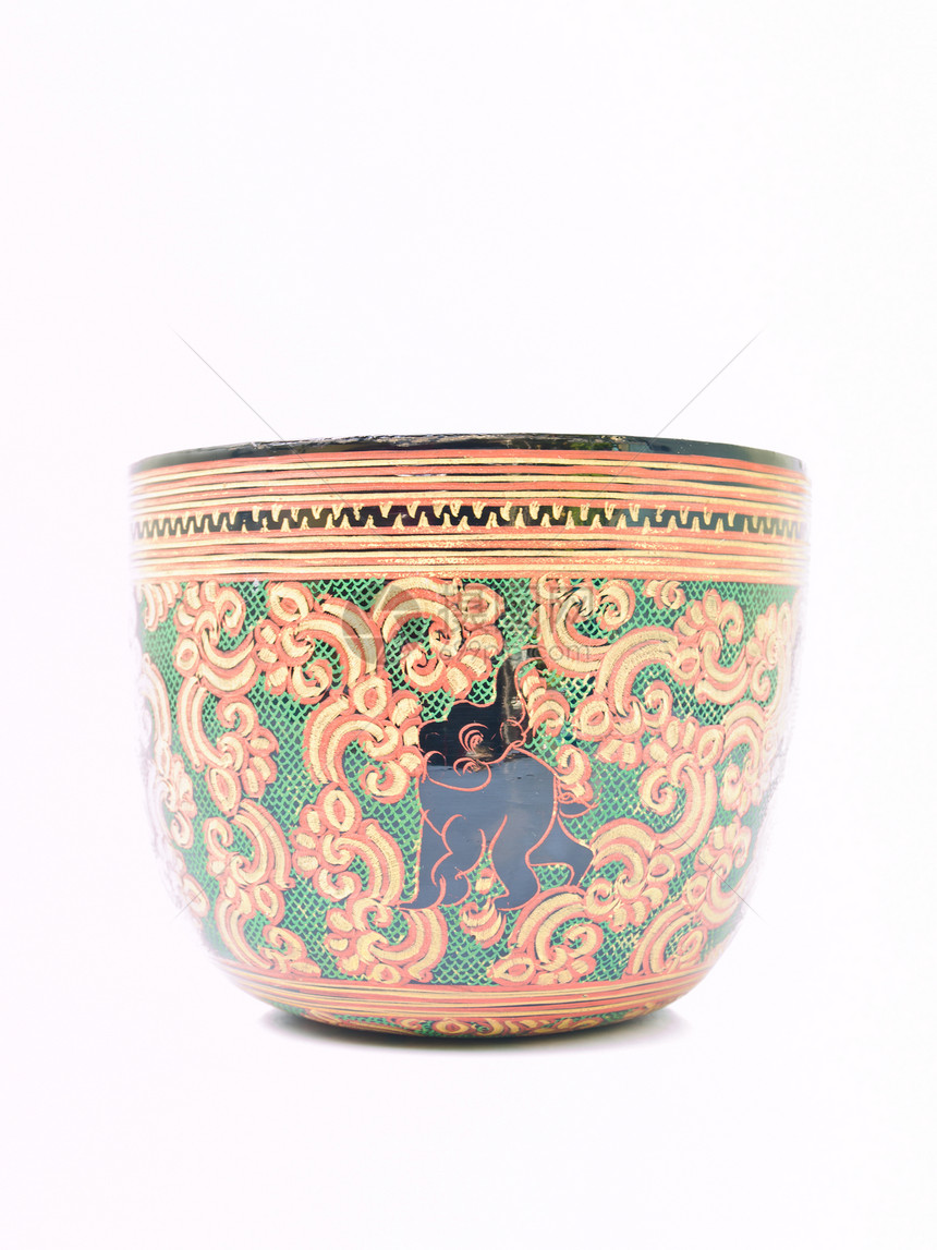 一个艺术的花瓷碗 上面有被随意孤立的象像风格黑色手工业黄色漆器绿色红色白色工艺手工图片