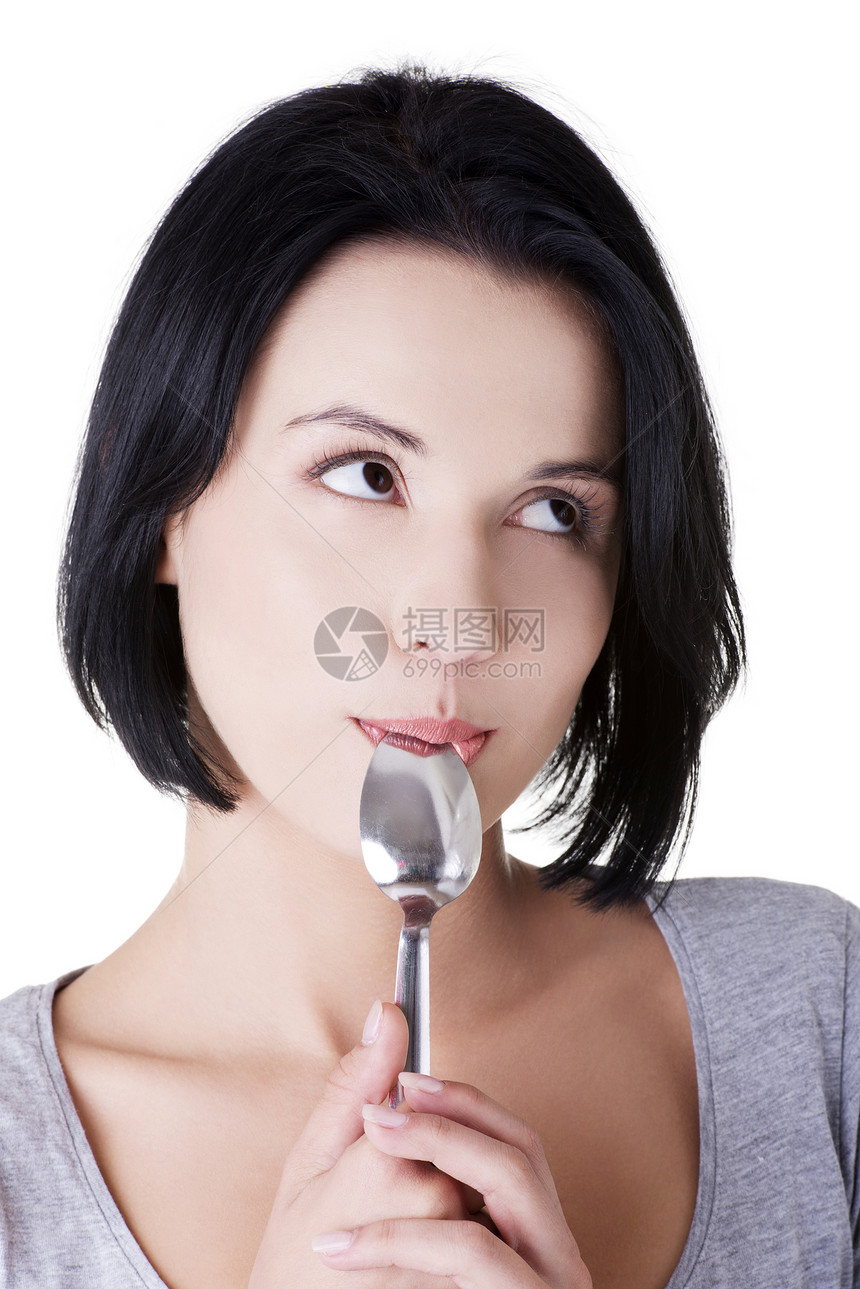 女人嘴里有勺子成人工具诱惑饮食食欲喜悦快乐女孩女性微笑图片