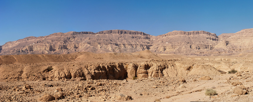 以色列内盖夫沙漠中小克拉泽的景色沙漠景观全景荒野石头远足橙子悬崖沙丘阴霾山脉蓝色图片
