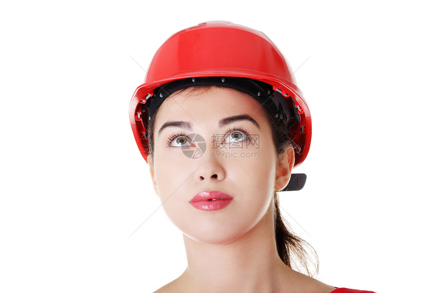 佩戴头盔的自信女工抬头看工作经理人士工人工程师承包商商业建筑学公司商务图片