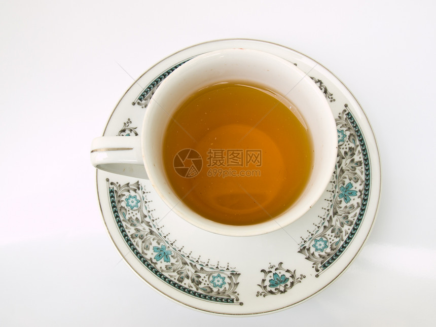 一杯茶 用白色背景隔绝的花粉形态棕色液体花朵草本玻璃时间早餐盘子饮料杯子图片