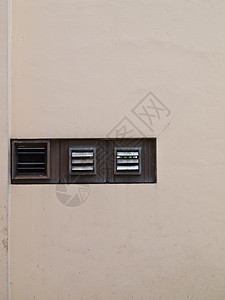 墙上作为背景的通风窗口办公室古铜色带子板条经济蓝色城市袖珍正方形建筑背景图片