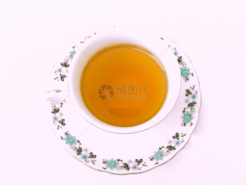 一杯茶 用白色背景隔绝的花粉形态草本玻璃棕色杯子液体早餐盘子时间饮料花朵图片