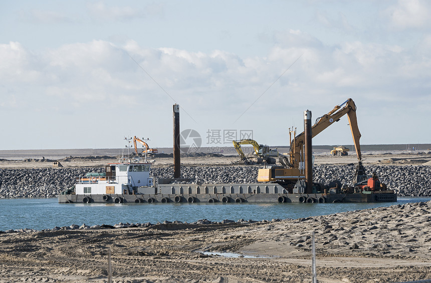 在荷兰Europort工作的挖泥船力量血管土地太阳贸易海岸机器海洋驳船支撑图片
