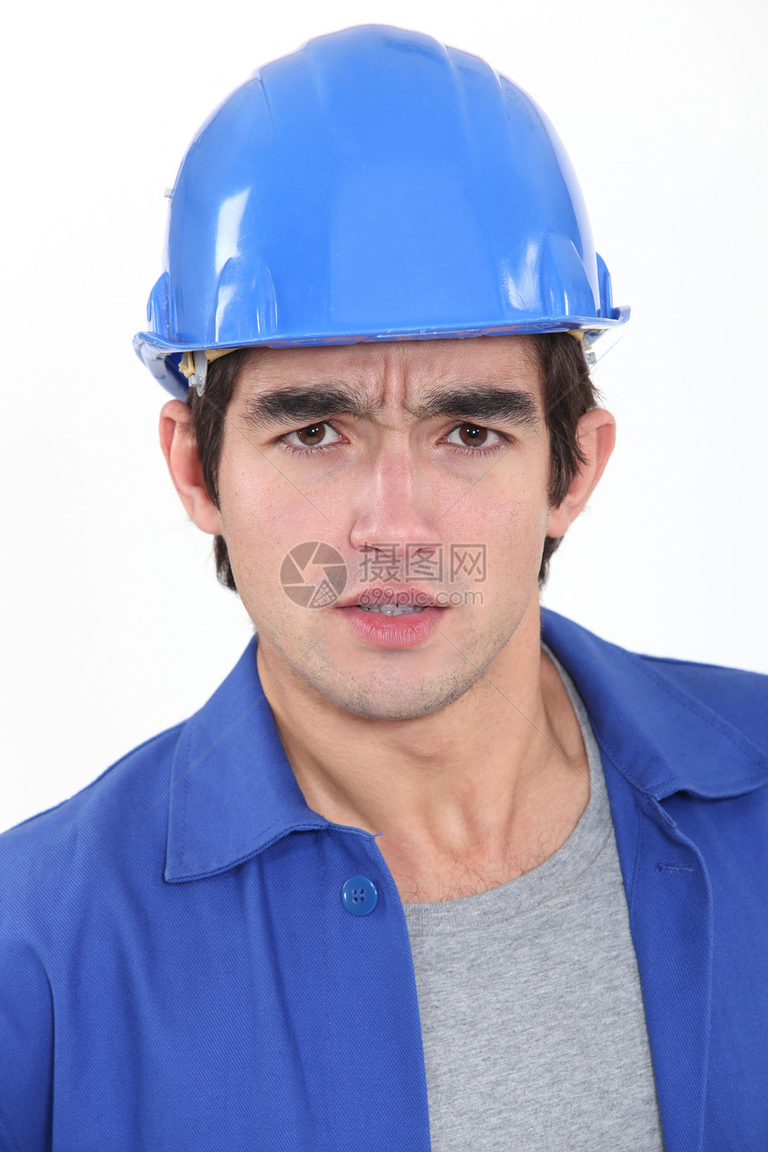 关心的建筑工人安全帽蓝色工厂修理工工作环境技术员工人男人健康图片