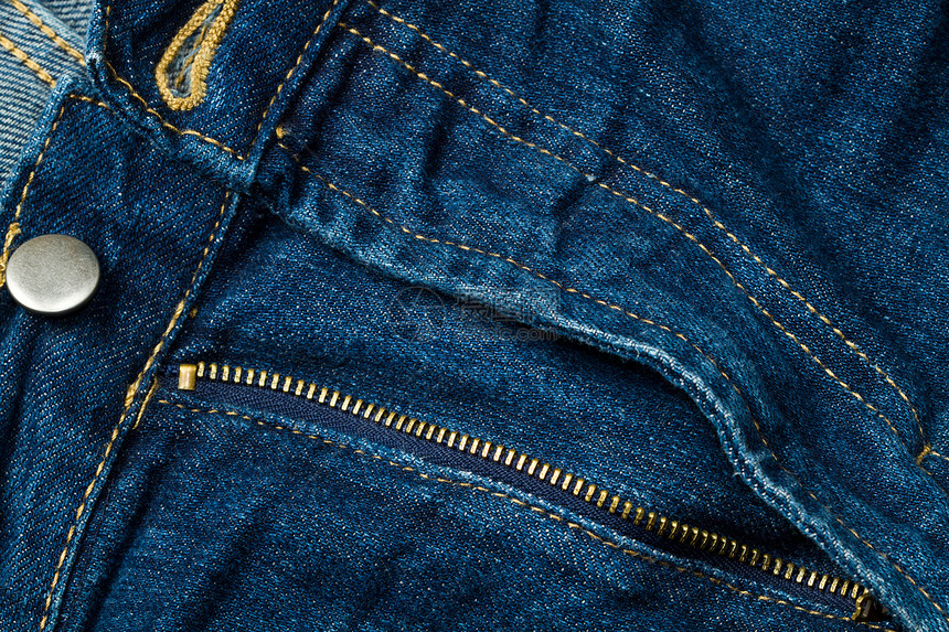 蓝色牛仔裤帆布缝合服装标签裤子棉布宏观接缝古董纺织品图片