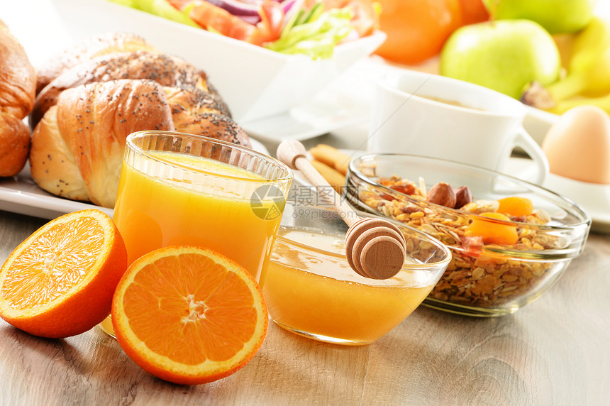 早餐 包括咖啡 面包 蜂蜜 橙汁 梅斯利a水果种子桌子坚果玻璃橙子饮食杯子香蕉果汁图片
