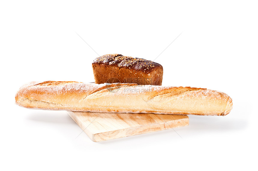 新鲜面包和长棍面包小吃食物化合物宏观白色粮食木板小麦棕色早餐图片