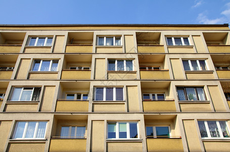 公寓楼住宅建筑学黄色单位物业建筑房子背景图片