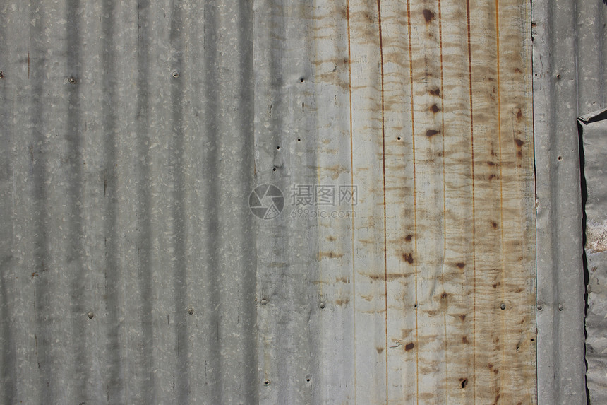 一条生锈的铁铁铁栅栏特写锌墙金属拉丝平铺技术插图瓷砖机库商业墙纸橙子图片