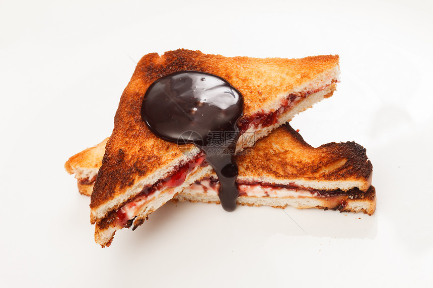 三明治加果酱和巧克力棕色早餐覆盆子白色奶油状小麦坚果小吃育肥午餐图片