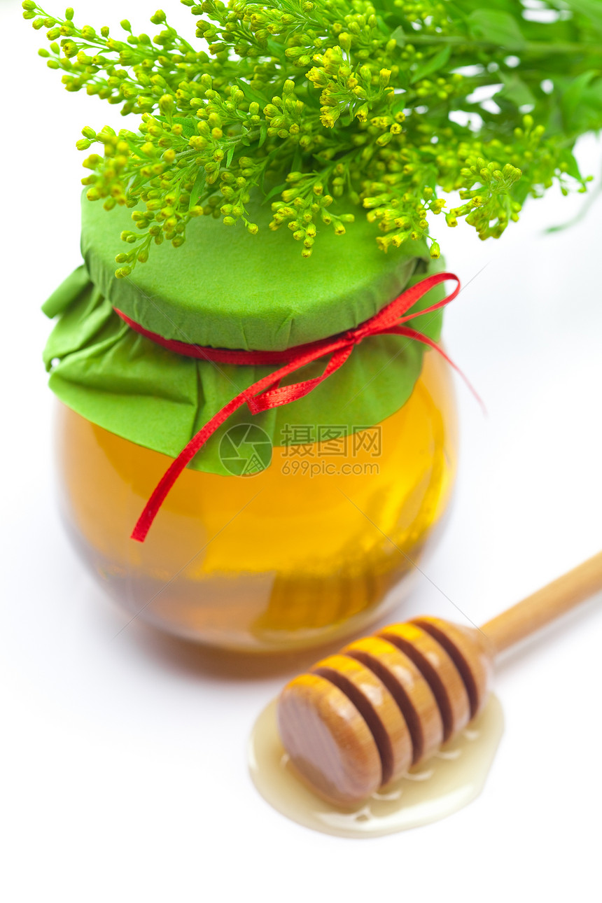紧紧粘在白色的蜂蜜和罐子上治疗香味早餐树叶玻璃丝带金子生活药品雏菊图片