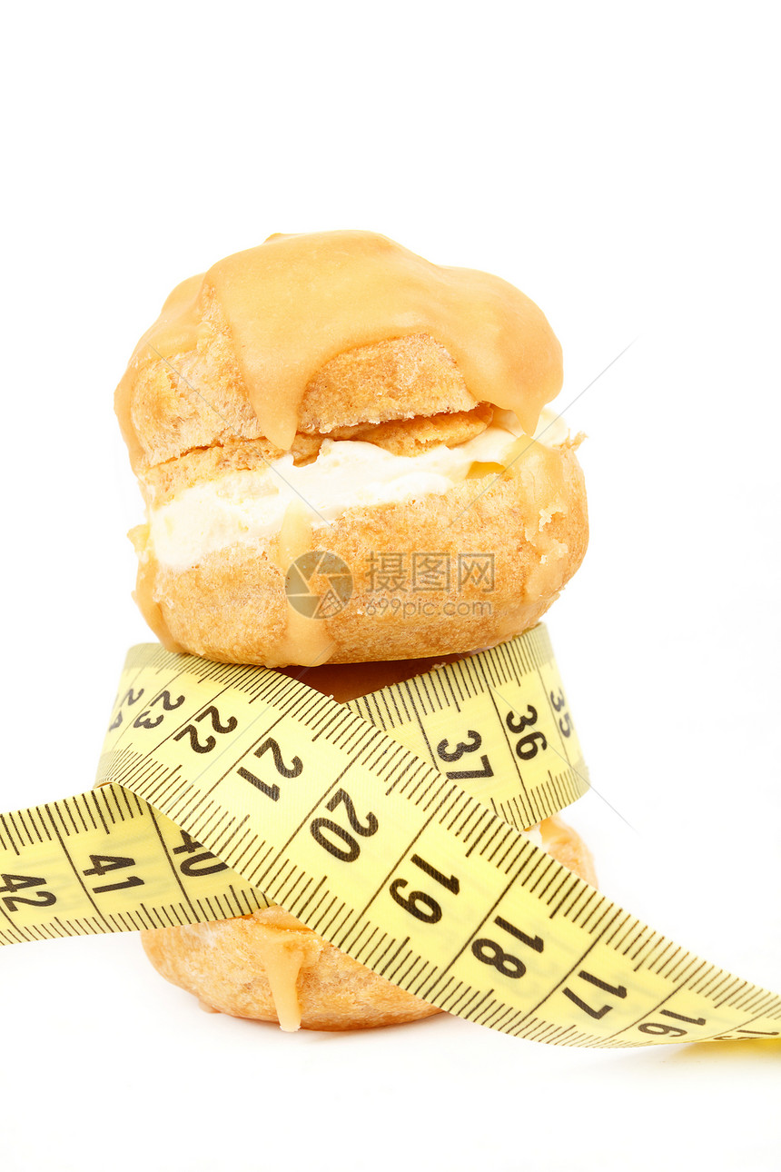 缩水 焦糖蛋糕和测量胶带的概念重量磁带糕点数字糖果味道奶油甜点焦糖食物图片