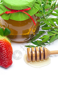 印度半透明草莓紧紧粘住胡海 草莓和蜂蜜罐头背景
