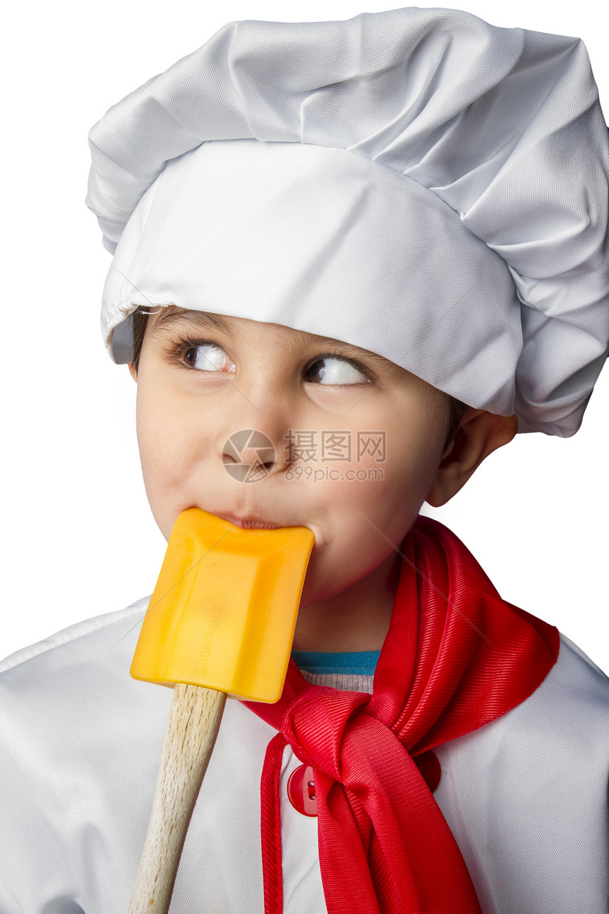 一个穿着制服的小厨师 孤立在白色背景上图片