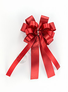 红弓丝绸包装惊喜派对生日念日白色庆典丝带红色背景图片