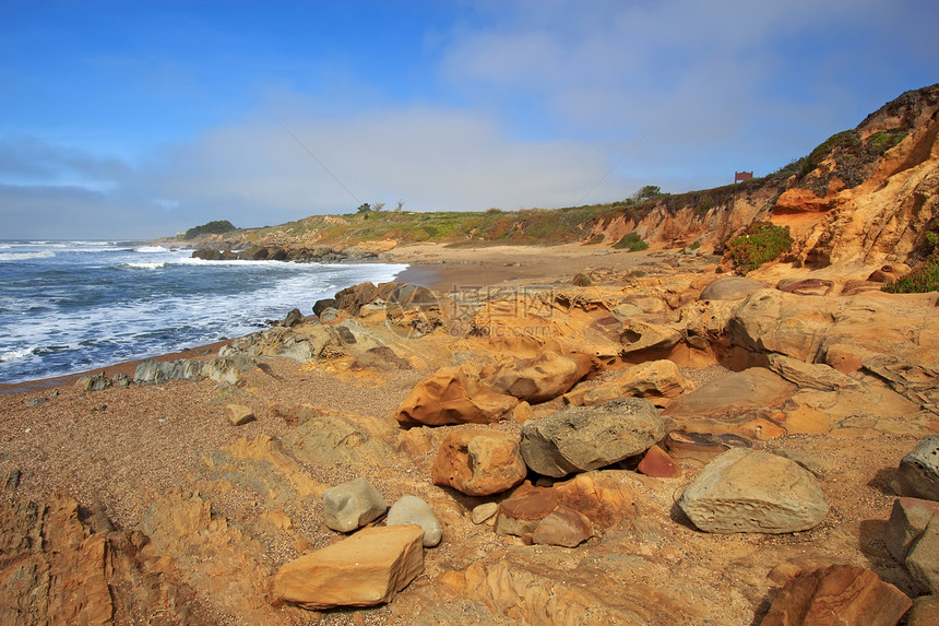 加利福尼亚Bean Hollow州海滩的比安霍洛滩石头海洋橙子沉积地标海岸砂岩支撑口袋冲浪图片
