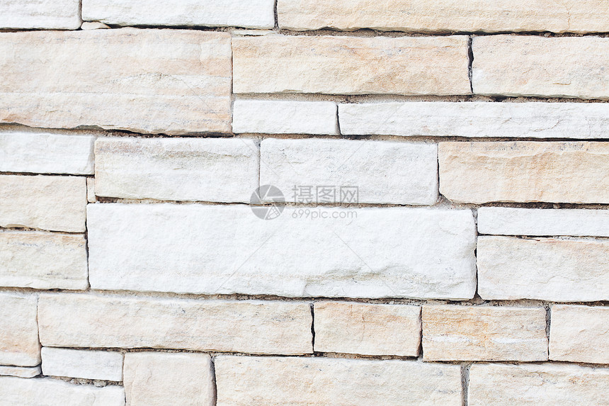 石头铺路面的背景壁板事项岩石铺路力量财产石墙材料鹅卵石注意图片