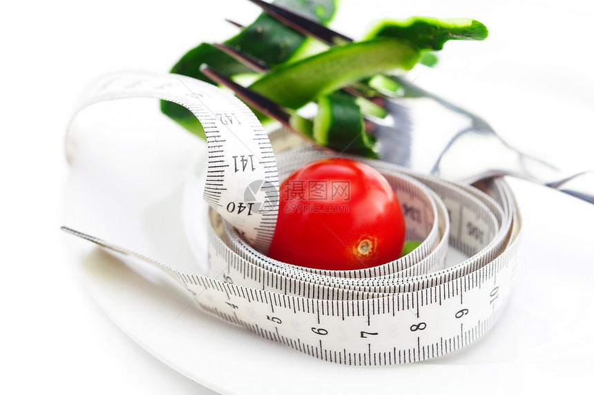 番茄 叉子 黄瓜皮肤和测量板上隔绝的磁带用具水果陶瓷厘米尺寸测量饮食营养玉米蔬菜图片