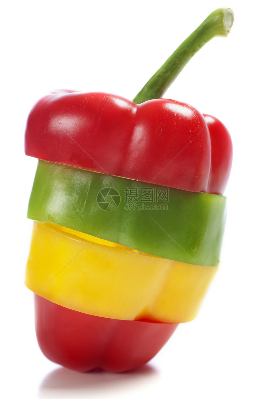 三个胡椒混合成一个生产蔬菜黄色红色绿色图片