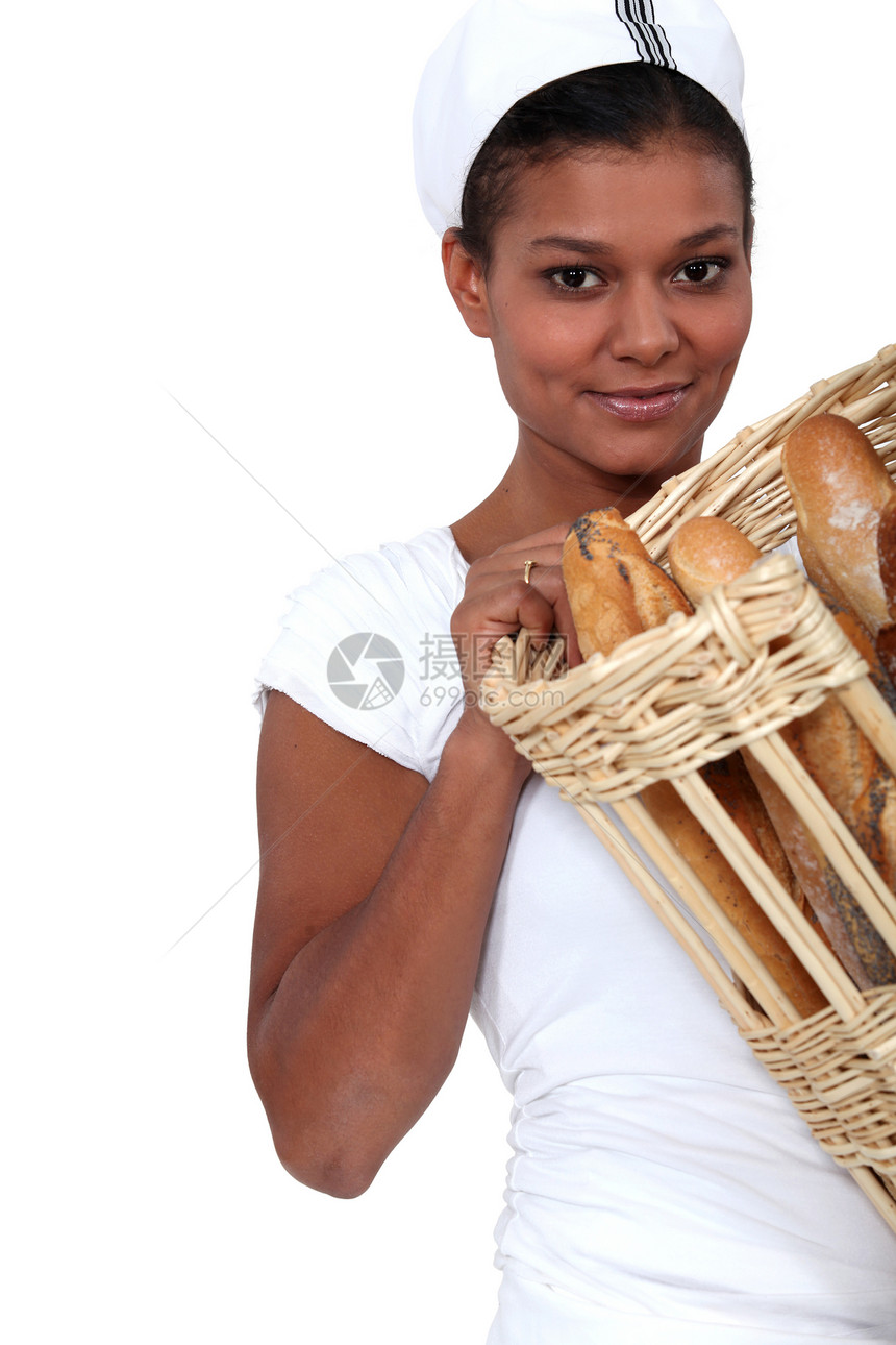 妇女面包师和一篮面包图片