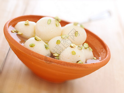 印度里拉丘拉甜点食物水平垃圾芝士奶制品糖浆高清图片