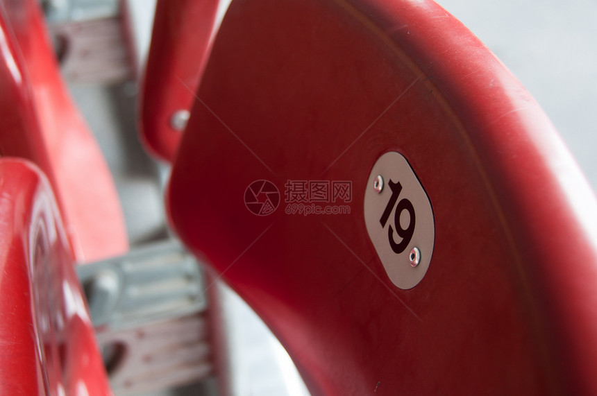 体育场座竞技场欢呼塑料红色椅子足球棒球露天橙子观众图片