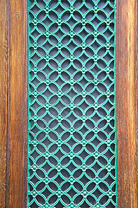 城门上的绿色油漆金属格子背景图片