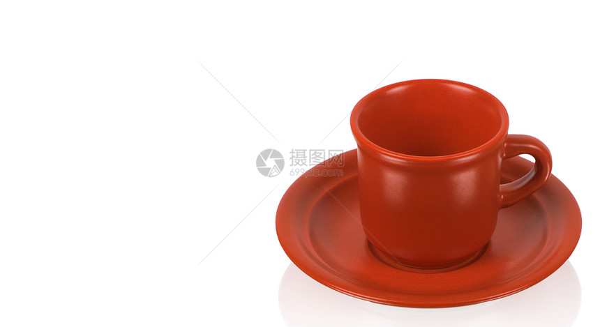 红杯在红碟上飞碟咖啡店陶瓷咖啡饮料食物制品杯子盘子反射图片