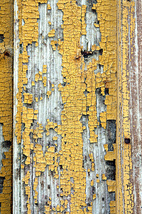 旧门纹理黄色谷仓材料衰变棕色剥皮条纹农场裂缝木头背景图片