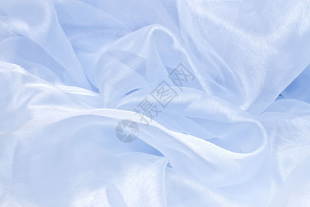 蓝沙子纺织品天鹅绒涟漪曲线衣服海浪蓝色折叠背景图片