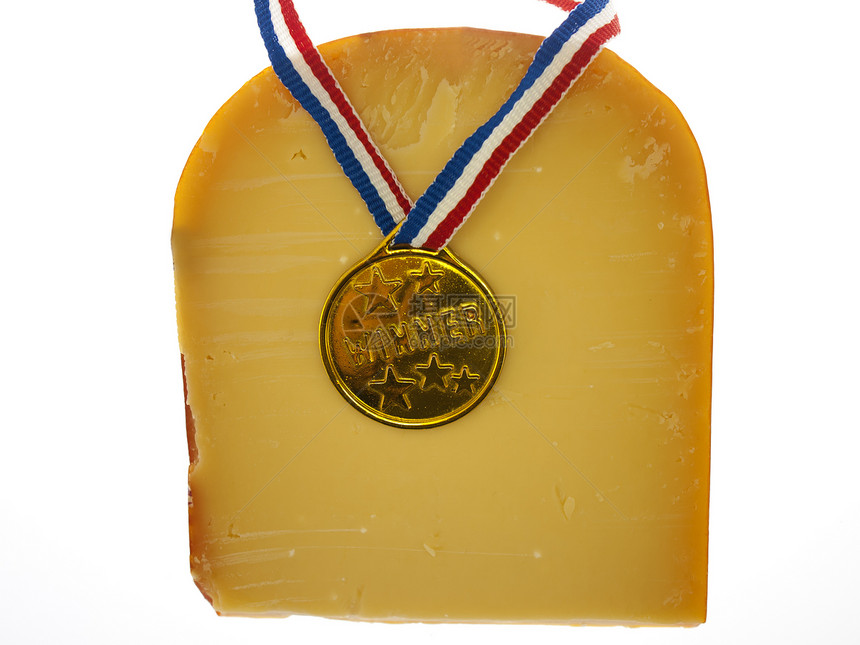 一块奶酪和一枚赢家奖牌烹饪黄色勋章小吃黑色食物牛奶产品熟食午餐图片