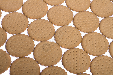 许多饼干小吃圆圈蛋糕工作室白色甜点糕点圆形营养棕色背景图片