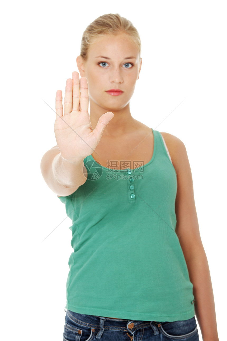 年轻女性做出停止手势的明亮画面青少年白色商业金发女孩学生抑制棕榈禁令警告图片