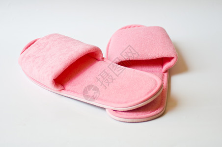 粉色拖鞋鞋类家庭纺织品材料时尚白色背景图片