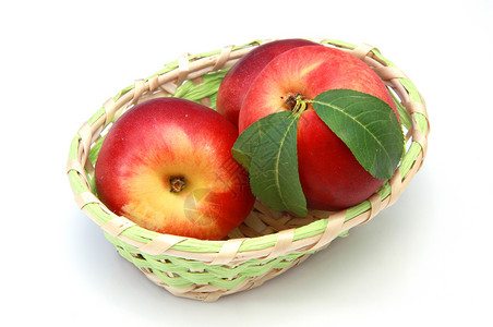 桃子篮子白色黄色水果绿色健康营养饮食红色橙子背景图片