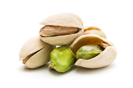 Pistachios 螺旋藻饮食水果绿色宏观营养甜点食物坚果白色背景图片