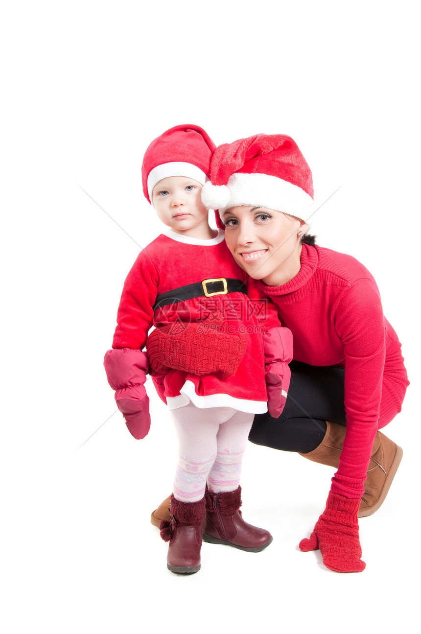 圣诞老人母亲和女儿在工作室成人孩子女性女士帽子红色婴儿微笑女孩家庭图片