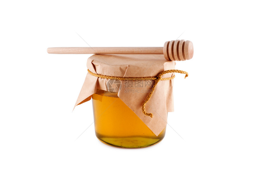 蜂蜜在罐子木勺中 孤立的白色图片