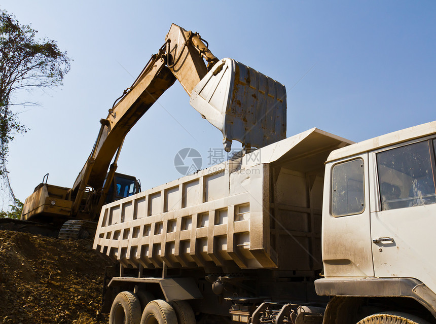 挖掘机装载车和卡车机械运输黄色机器工作工业推土机液压丁烷金属图片
