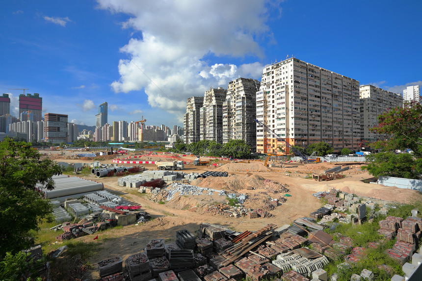 城市建筑工地机械砖块工作蓝色房子基础设施天空构造摩天大楼头盔图片