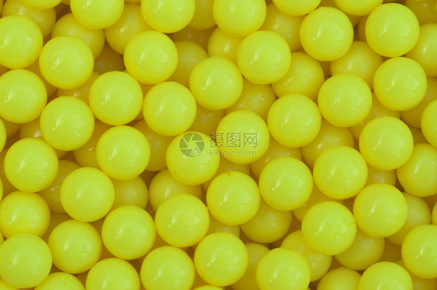 黄黄色塑料背景水平爱好宏观包装材料纺织品墙纸圆形黄色按钮图片